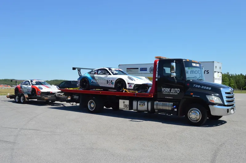 A race car loaded on a York Auto flatbed