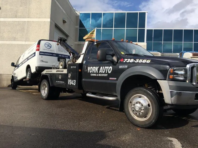 A York Auto wrecker towing a van